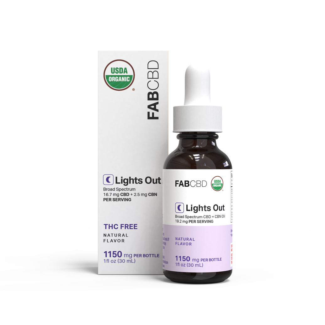 FAB CBD 'Lights Out' broad spectrum CBD + CBN oil, showing a white box with a green USDA Organic seal and lavender accent next to an amber glass dropper bottle with a white cap and lavender label, both displaying 'Broad Spectrum CBD + CBN Oil, 18.2 mg Per Serving, THC Free, Natural Flavor, 1150 mg Per Bottle, 1 fl oz (30 mL),' on a white background.
