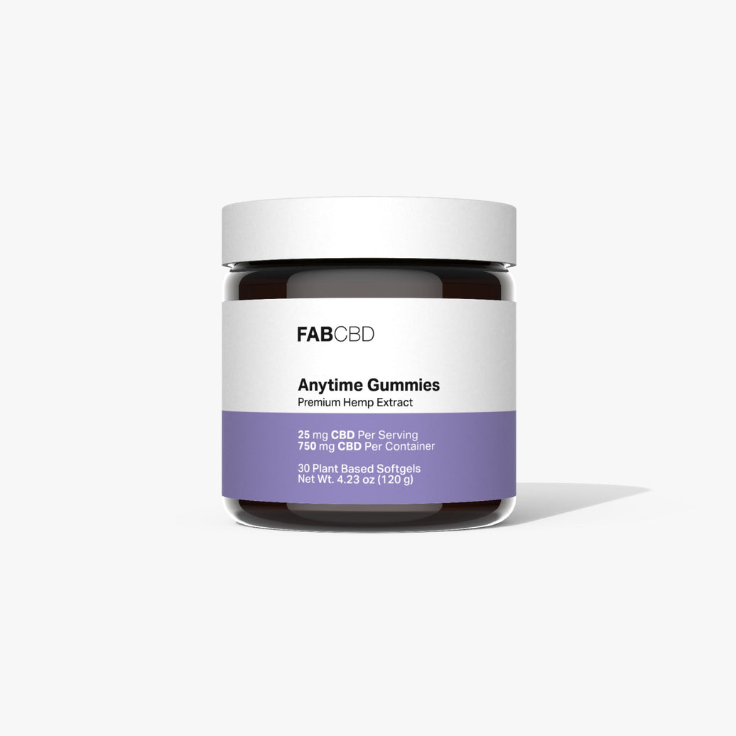A dark glass jar of FAB CBD Anytime Gummies against a plain white background. The front label features a purple band detailing 25 mg CBD Per Serving, 750 mg CBD Per Container, 30 Plant Based Softgels, Net Wt. 4.23 oz (120 g).